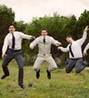 Groom and Groomsmen Jumping by Jagger Photography