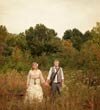 Bride and groom in a field