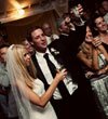 Newly married couple toast by Once Like a Spark Photography
