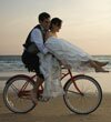 Married couple riding a bike
