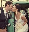 Newlywed couple with vintage truck
